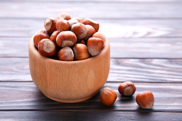 Delicious hazelnut in the wooden bowl