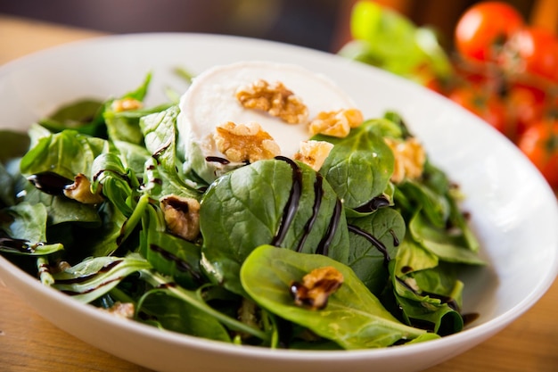 Delicious and healthy green salad with gratin goat cheese