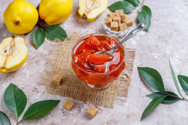 Delicious and healthy homemade quince jam in glass,top view