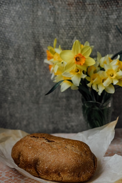 Delicious and healthy homemade whole grain bread with honey place for text yellow flowers