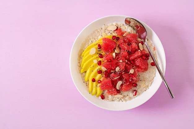 Delicious and healthy oatmeal with grapefruit, pomegranate, almond and chia seeds.  