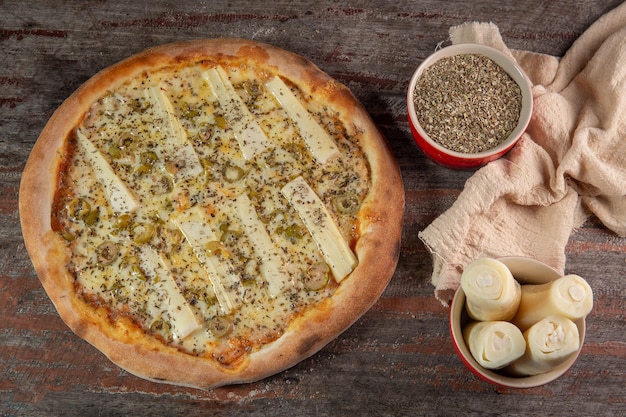 Delicious heart of palm pizza on wooden table