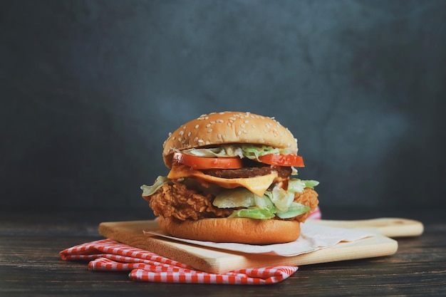 Delicious homemade beef burger on wooden table.