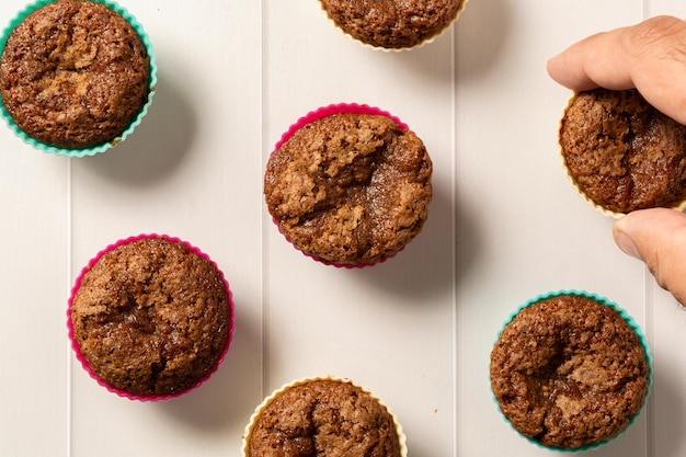 delicious homemade cupcakes freshly made over wooden table