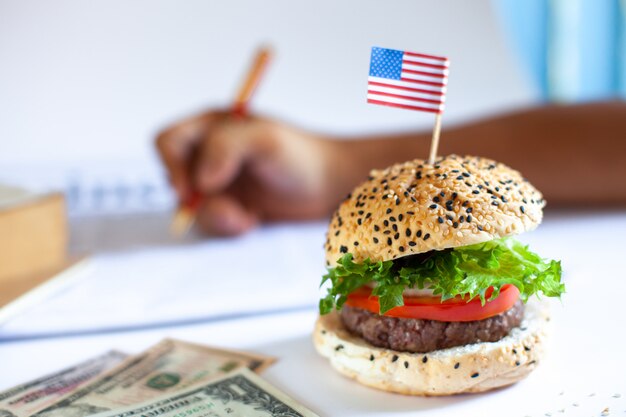 Delicious homemade hamburger with fresh vegetables in the office