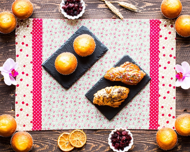 Delicious homemade muffins with yogurt, on a wooden surface with space for text.