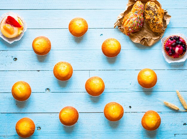 Delicious homemade muffins with yogurt, on a wooden surface with space for text.