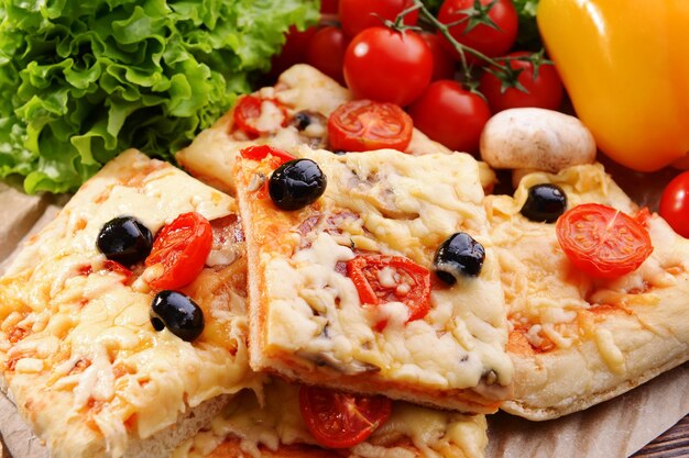 Delicious homemade pizza on table closeup