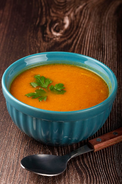 Delicious homemade pumpkin soup in bowl.