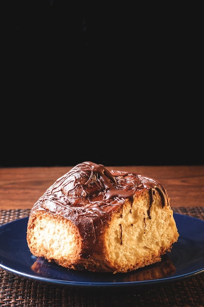 Delicious homemade sponge cake with chocolate placed on a white plate ideal for dessert