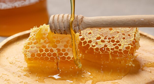 delicious honeycomb bees with bucket full of honey