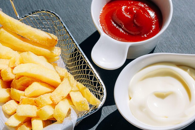 Delicious and hot fries with different sauces