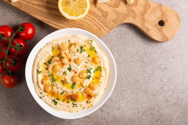 Delicious hummus with chickpeas olive oil lemon and pita bread Vegetarian food concept