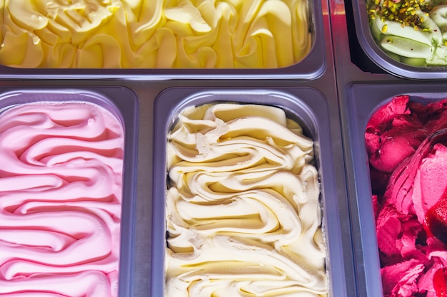 Delicious ice cream of different flavors and colors on a confectionery shop