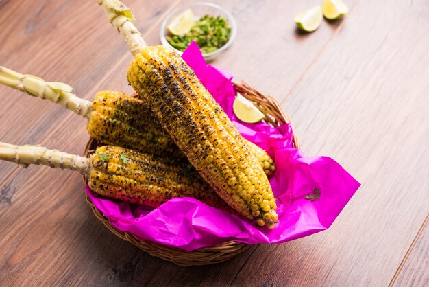 Delicious Indian street corn cob also called Bhutta, flavoured with spicy chilli, butter etc. Selective focus