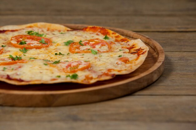 Delicious italian pizza served on pizza tray