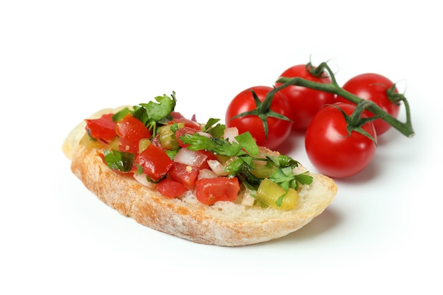 Delicious italian snack bruschetta and tomatoes on white background