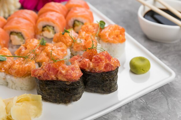 Delicious Japanese rolls on a white plate