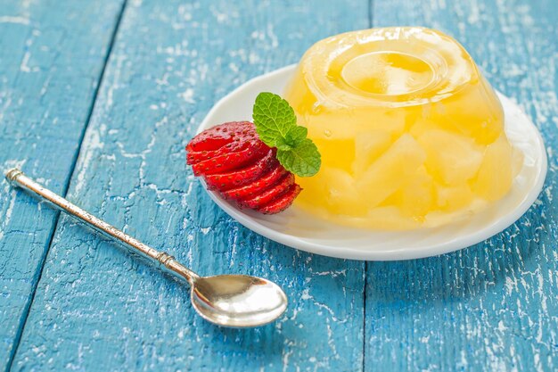 Delicious jelly pineapple strawberry and dessert spoon