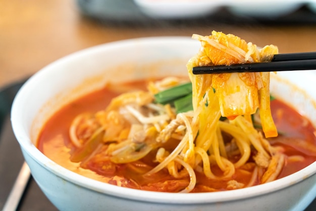 Delicious jjamppong jjambbong Chinesestyle Korean noodle soup topped with spicy seafood and kimchi broth in South Korea