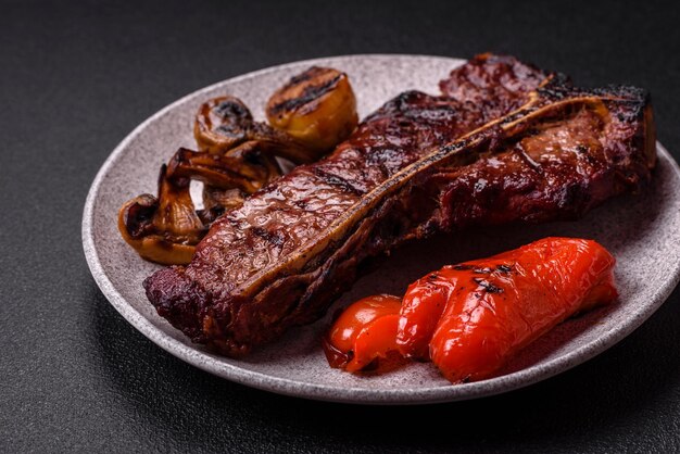 Delicious juicy beef tbone steak with salt spices and herbs