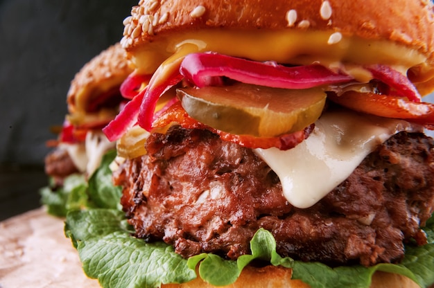 A delicious and juicy burger home in a rustic style with a big chop of beef