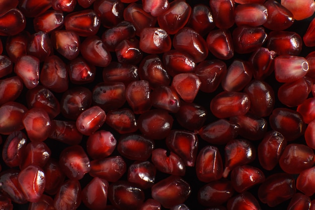 Delicious juicy pomegranate on a black background