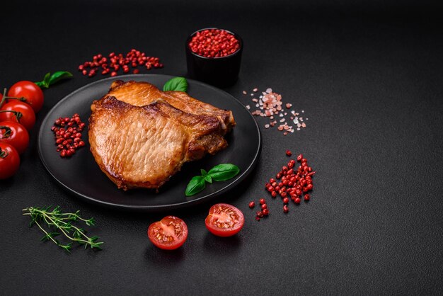 Delicious juicy pork or beef steak with salt spices and herbs