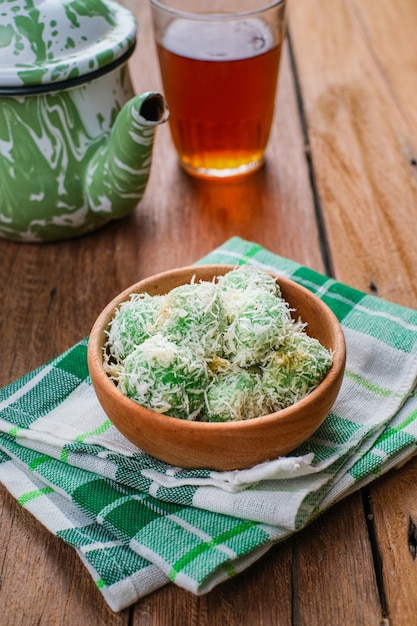 Delicious klepon traditional indonesian culinary over wooden\
table