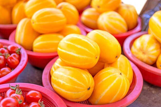 Delicious korean stripe yellow melon fruit food in red plastic basket at tradition market