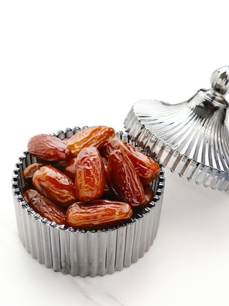 Delicious Kurma Tunisia Sweet Dried Dates palm fruits on glass bowl