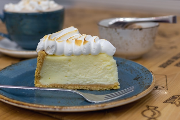 Delicious lemon tart with meringue closeup