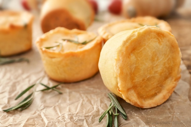 Delicious little meat pies on table