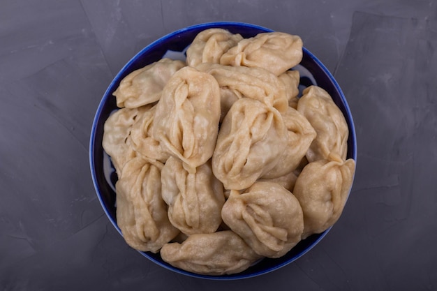 Delicious mantas on a plate on gray background