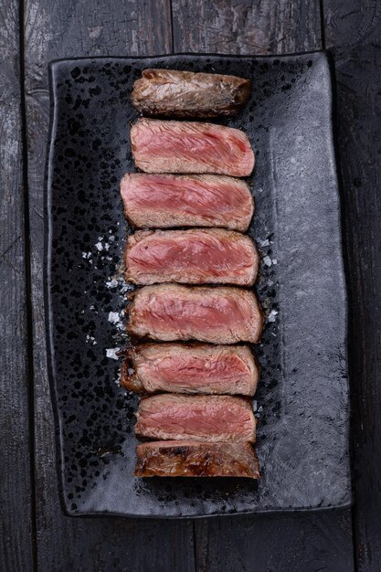 Delicious marbled meat on a dark background Close up