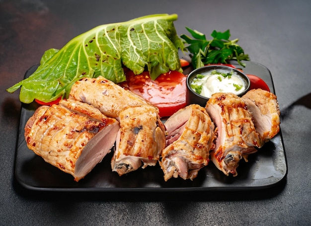 Delicious meat with Chickens Boti green on dark surface