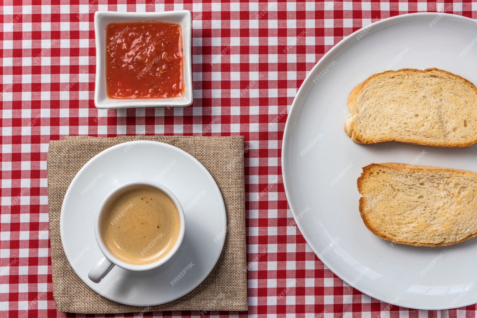 Premium Photo | Delicious mediterranean breakfast consisting of toast with tomato and coffee, served on a vintage plaid tablecloth and a burlap napkin. .