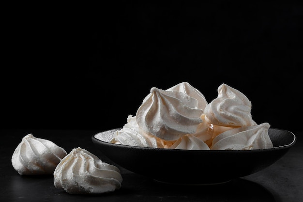 Delicious meringue cookies on the table