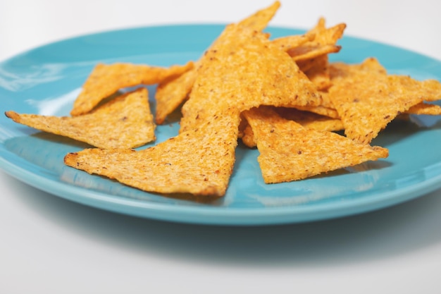 Delicious Mexican Nachos Corn Chips on a Blue Plate