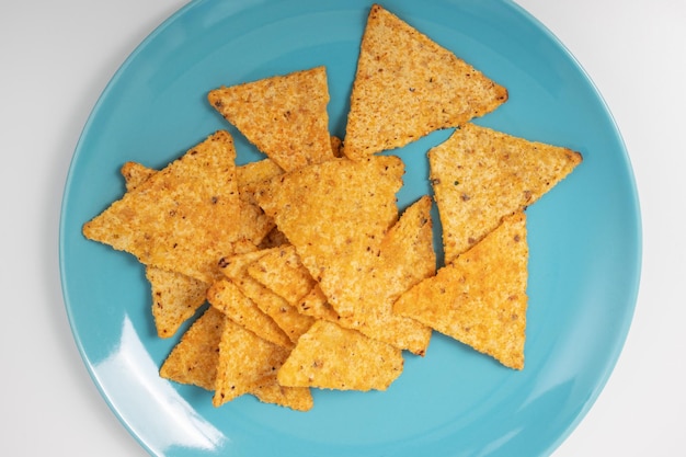 Delicious Mexican Nachos Corn Chips on a Blue Plate