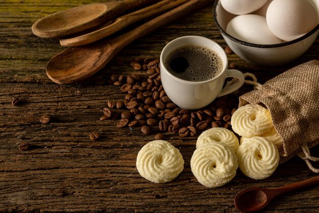 Delicious mini butter flavored milk and Sequilhos guava cookies with a cup of coffee served