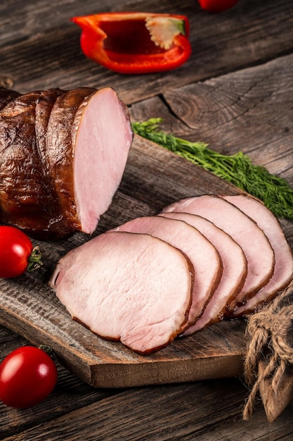 A delicious naturally smoked ham on wood cutting board banner menu recipe place for text