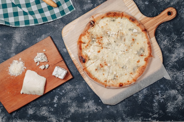 Delicious Neapolitan pizza with cheese. four kinds of cheese. concept of delicious italian pizza.