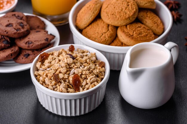 Delicious nutritious healthy breakfast with granola eggs oat cookies milk and jam Healthy eating at the beginning of the day