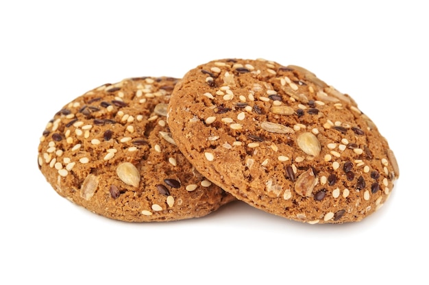 Delicious oat cookies with sesame on white background