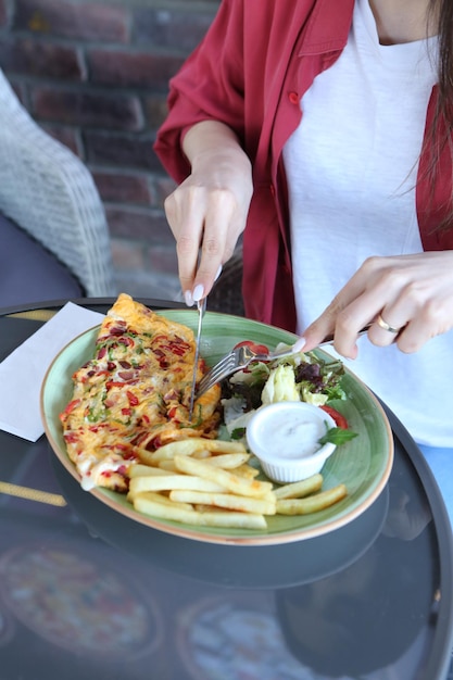 Delicious omlette and breakfast plate on the table.