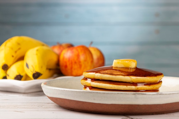 Delicious pancakes with butter and honey