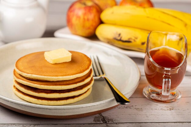 Delicious pancakes with butter and honey