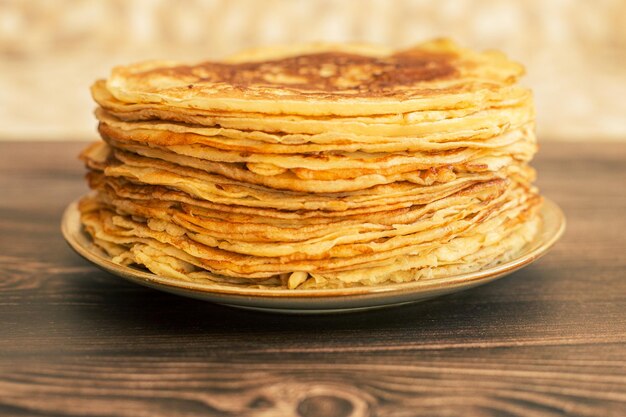 Delicious pancakes with chocolate sauce fresh blueberries on a rustic wooden table rustic brown tabl