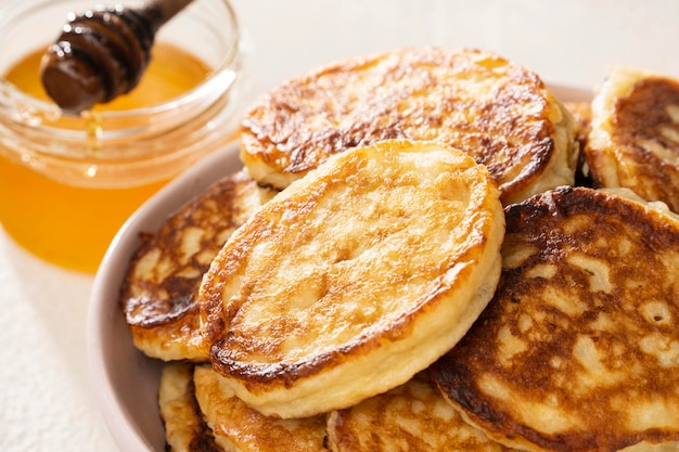 Delicious pancakes with honey for breakfast